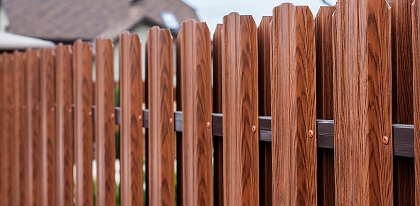Metal picket fence with wood imitation