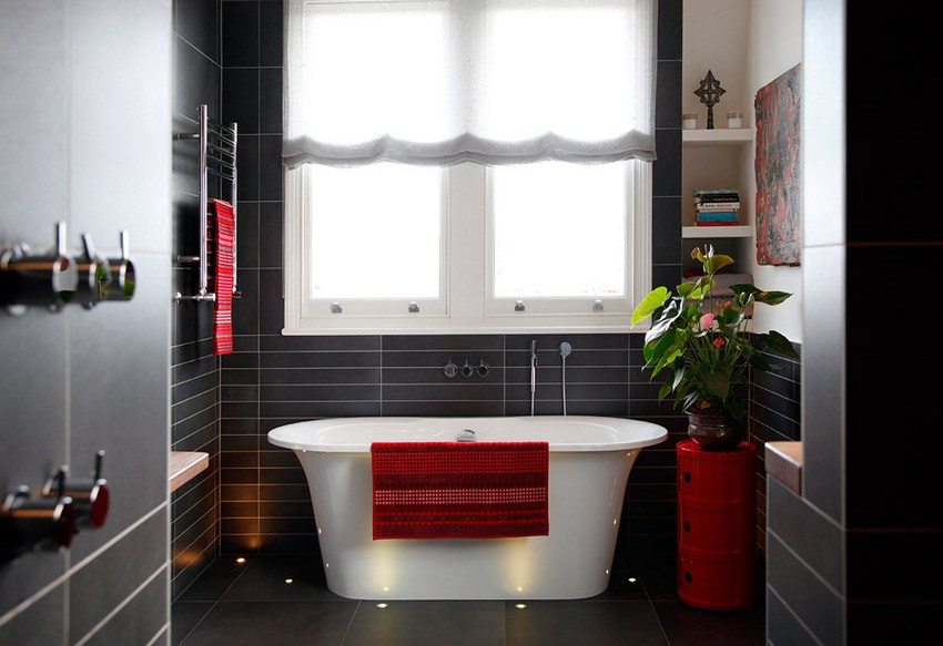 The walls of a modern bathroom are decorated with plastic panels that imitate tiles