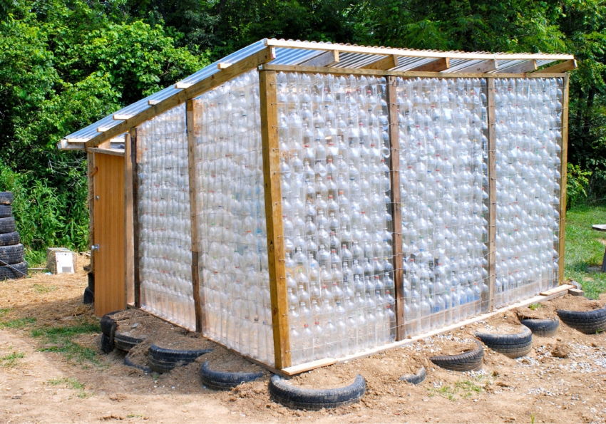 An example of a complex greenhouse design made of plastic bottles and a wooden frame