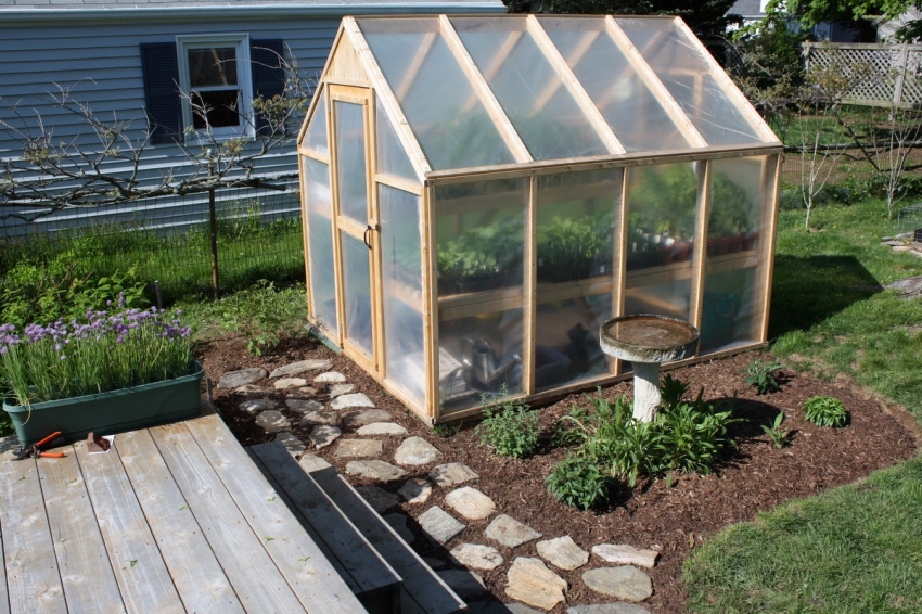 The most economical option for creating a greenhouse is to use plastic wrap and unnecessary wooden boards.