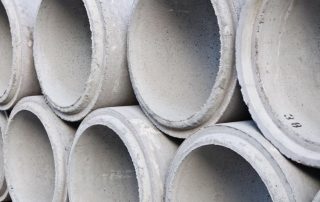 Inele de beton pentru canalizare: dimensiuni, prețuri și aplicarea produselor