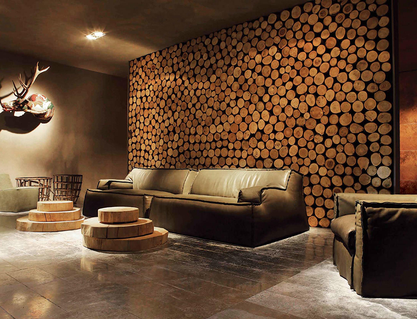 Using wooden log cabins for wall decoration