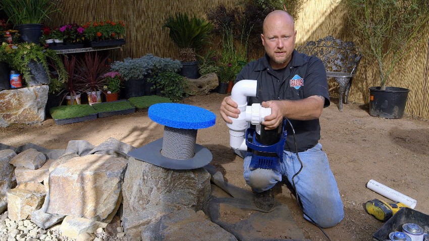 The submersible pump for the fountain is mounted on a brick pillow or a plastic pedestal