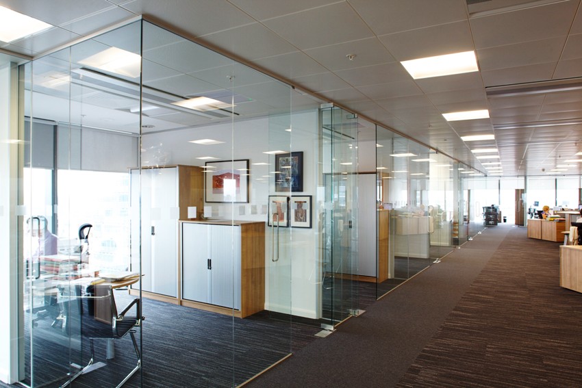 Glass partitions are suitable for office zoning when you need to create several individual workplaces