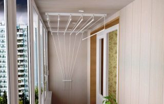 Ceiling dryer for clothes on the balcony: advantages over other models