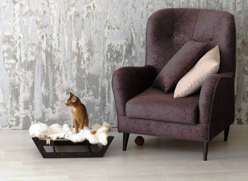 Le lieu de couchage pour le chat doit être conçu dans un style qui correspond à tout l'intérieur