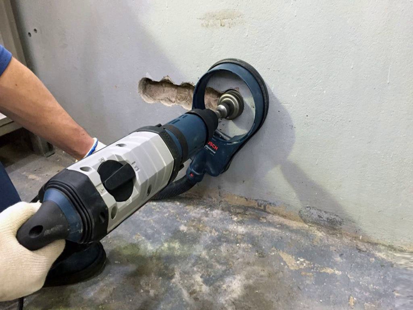 Special tools and nozzles are used to drill holes in concrete walls