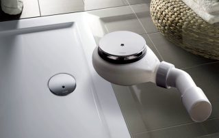 Sifó per a una cabina de dutxa amb base baixa: un element important del sistema de drenatge