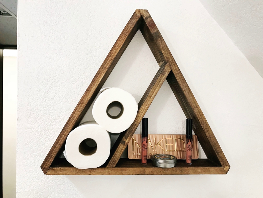 Triangular shelf made of wooden planks